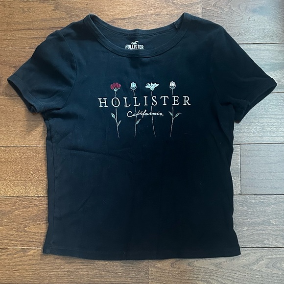 Hollister Tops - women’s black Hollister shirt with flower design !